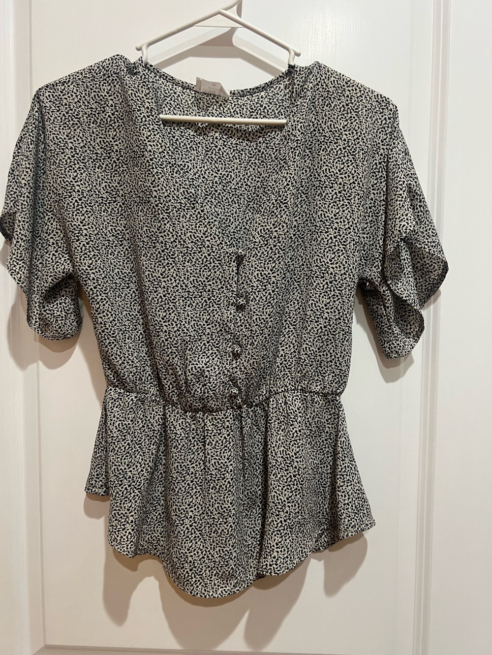 Sienna Sky Black and a Off-White Printed Button Peplum Top